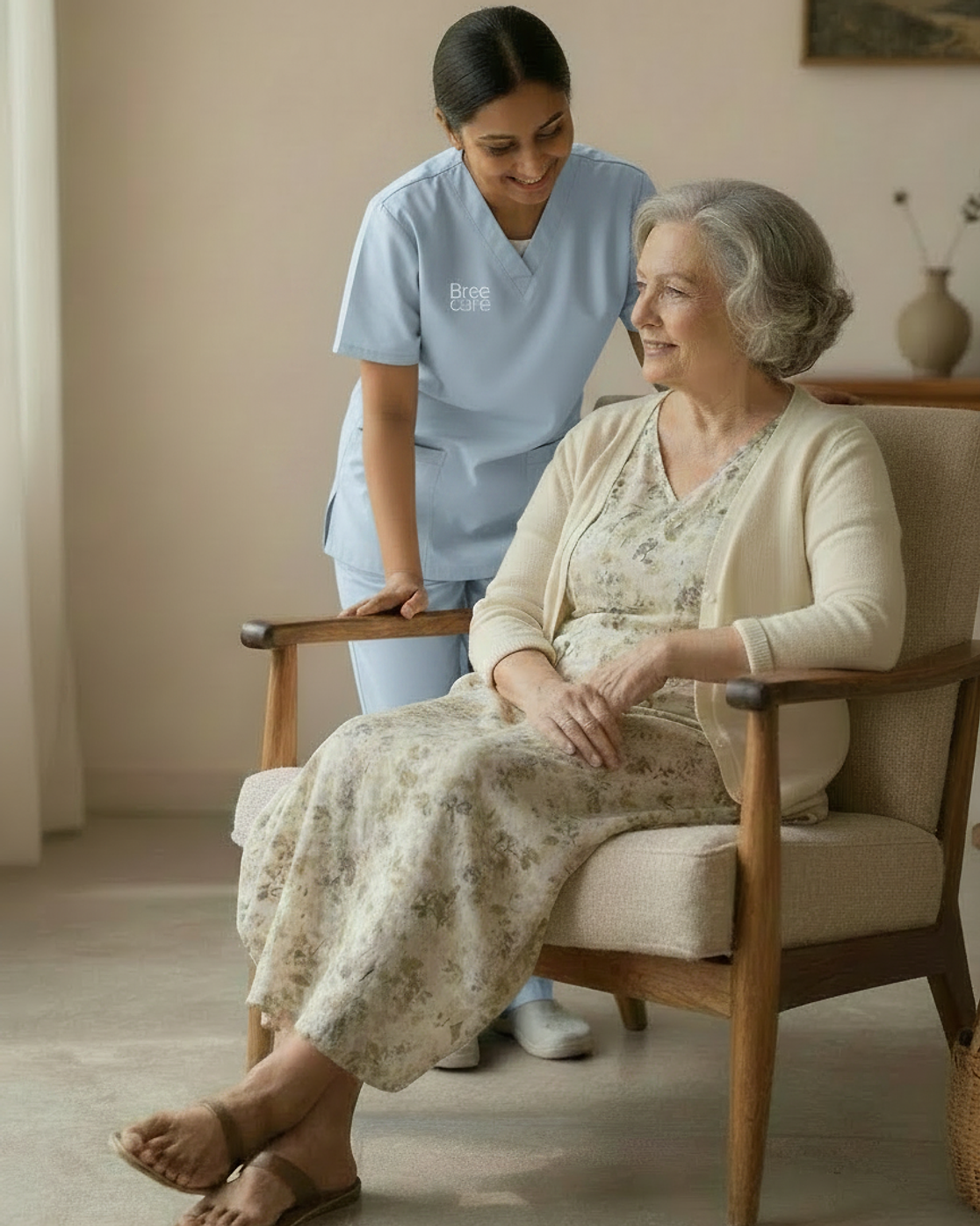 Caregiver supporting an elderly woman at home